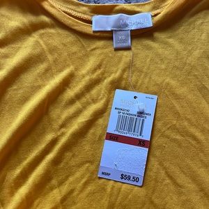 New with tags, ladies sleeveless, soft knit with contrast fabric